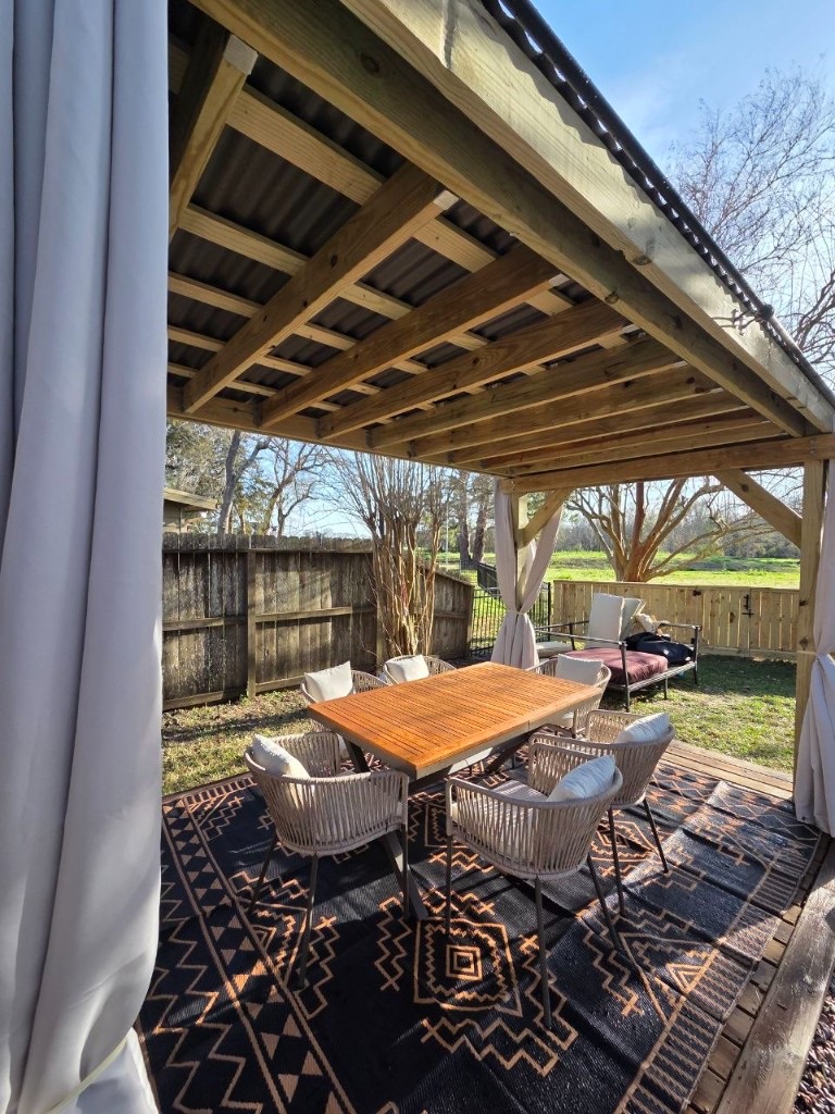 Pergola dining area before the full patio finish
