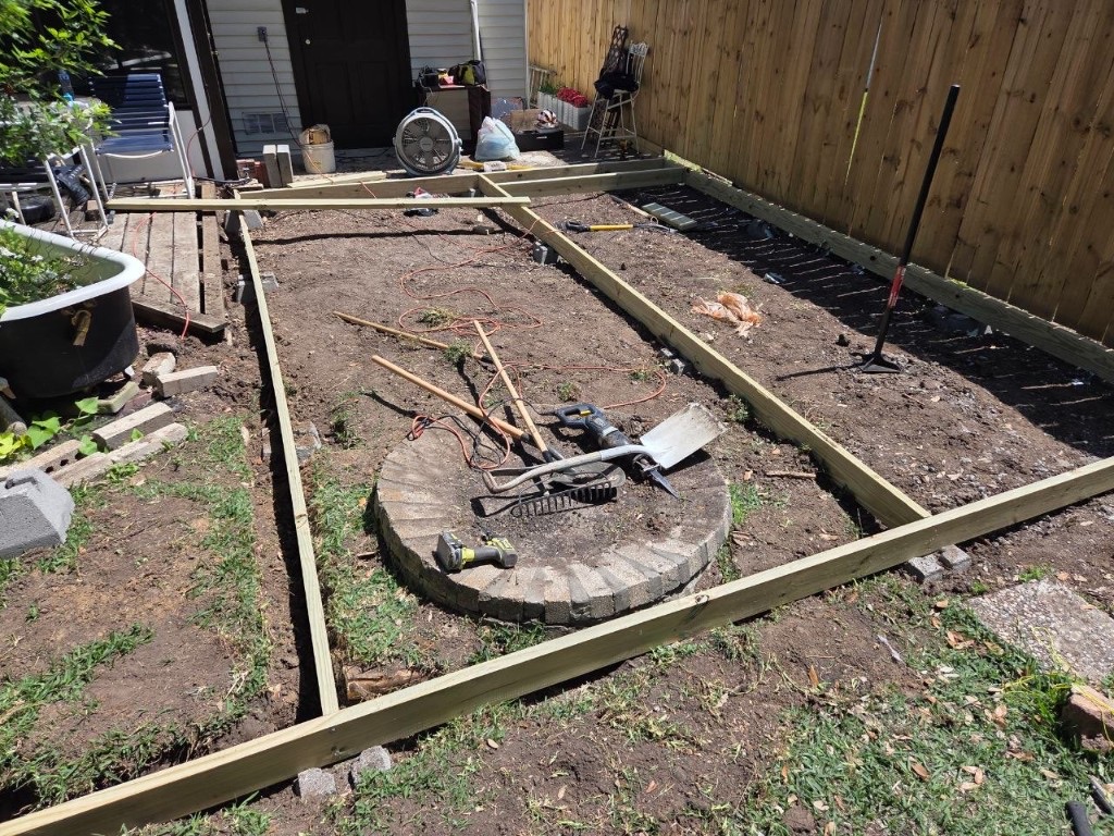 Yard cleared and framed at the start of a deck build